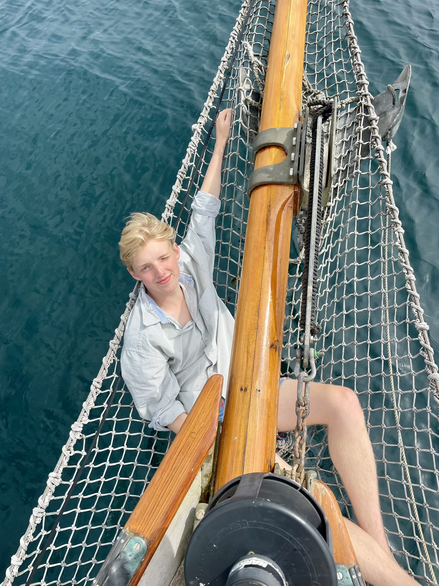 Sam Mayhew on a sailing boat